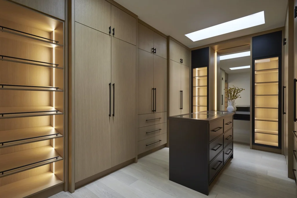 Walk‑in closet with built‑in shelving and hanging space.