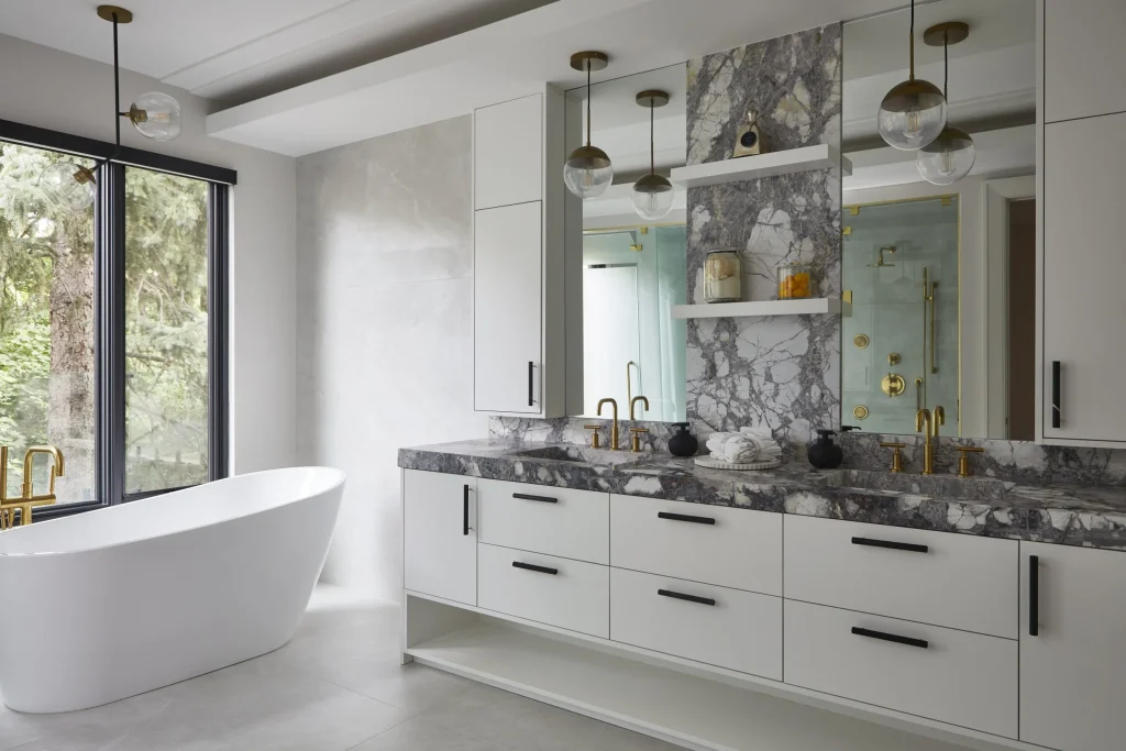Modern bathroom with marble finishes.‎