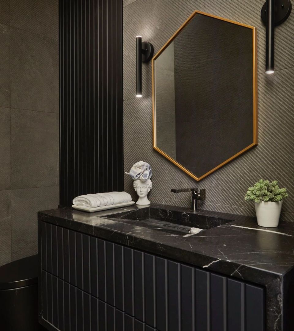 Compact bathroom with elegant fixtures.‎