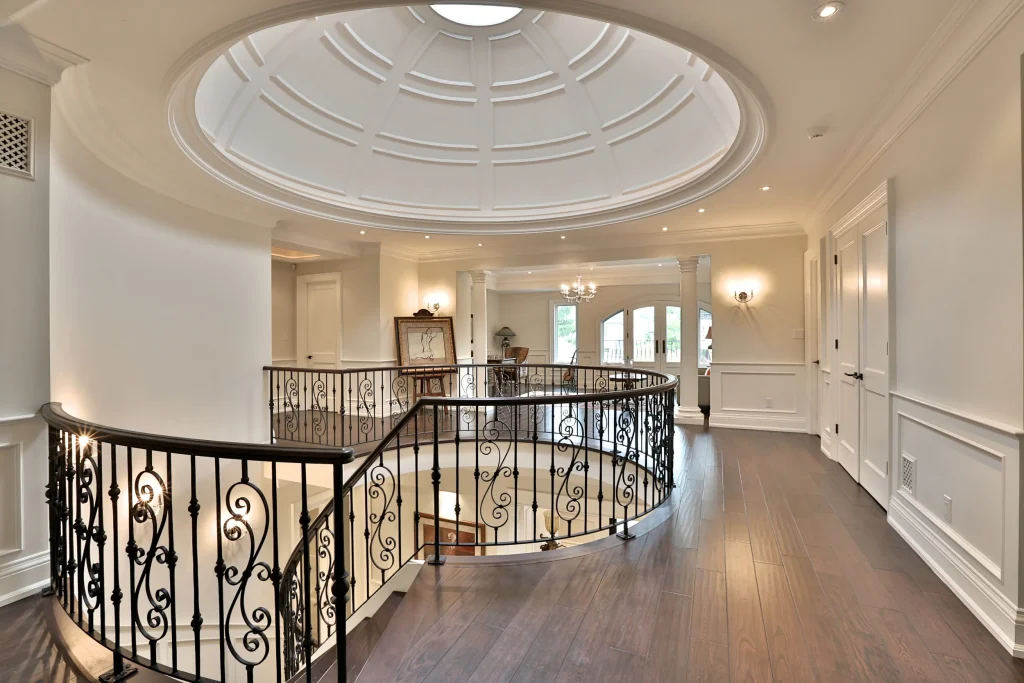 Second floor open hall with a domed ceiling and sculptural staircase.‎