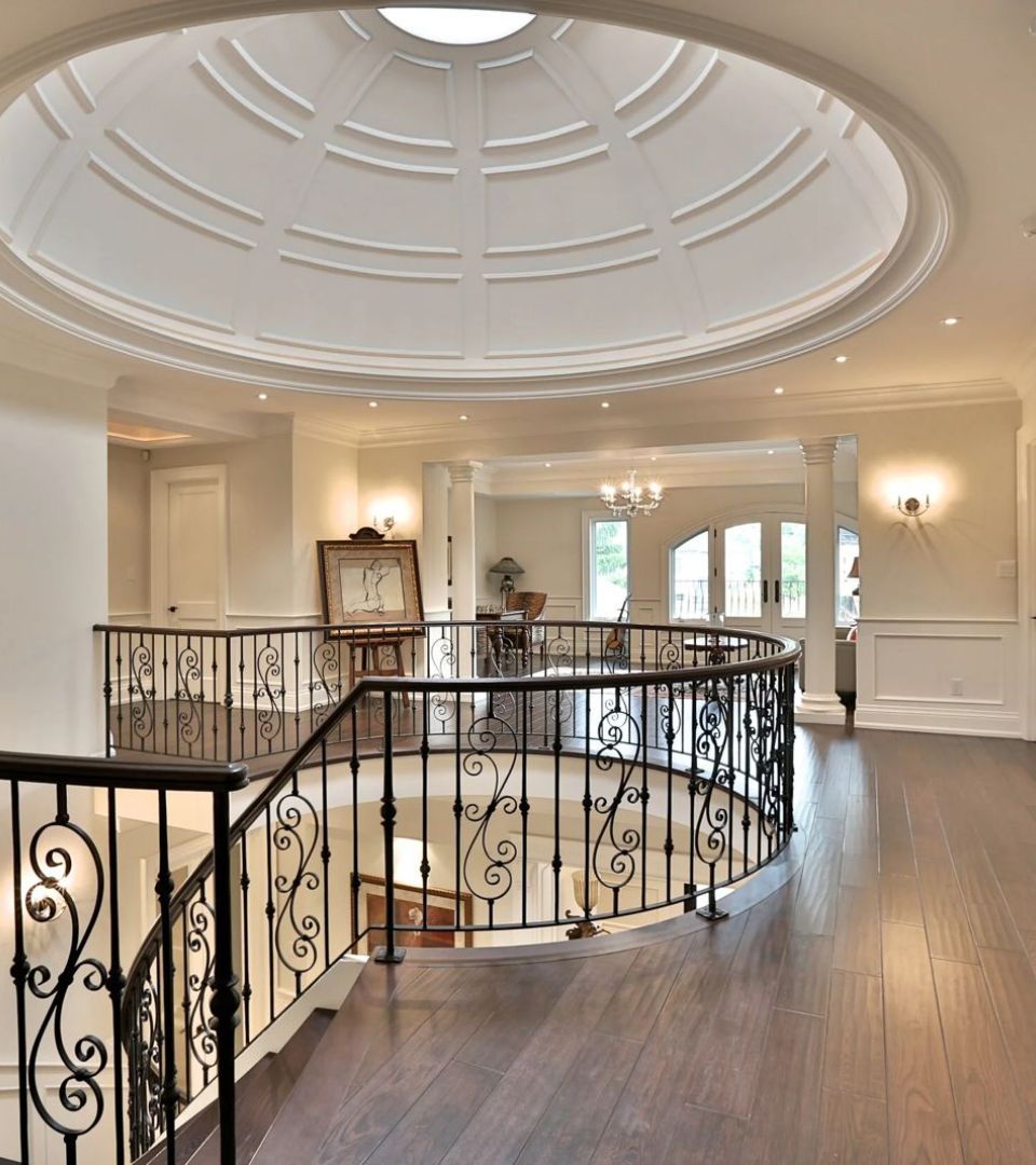 Showpiece room with a domed ceiling and sculptural staircase.‎